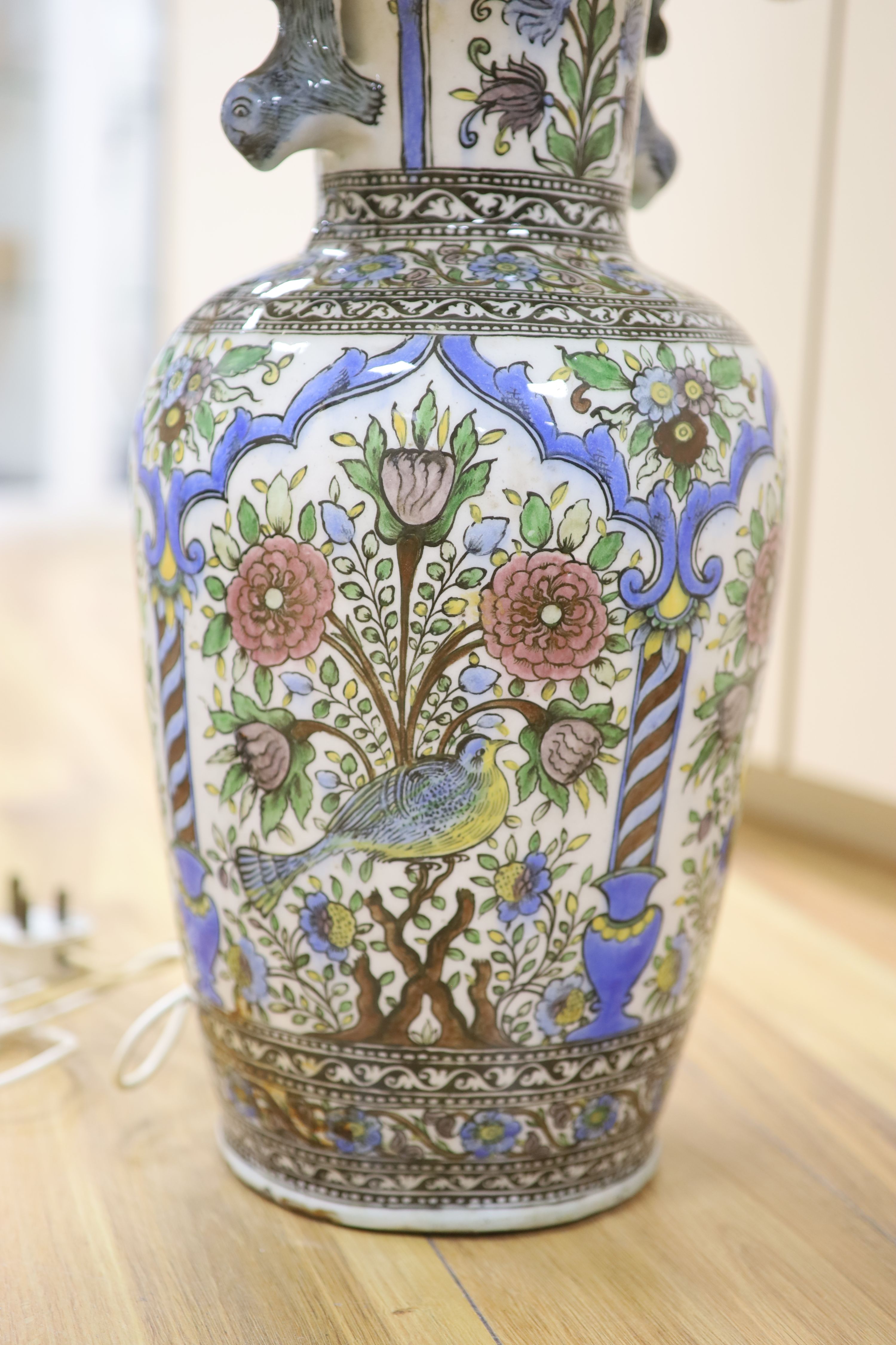 A pair of modern Persian-style pottery vases, fitted as table lamps, height 50cm